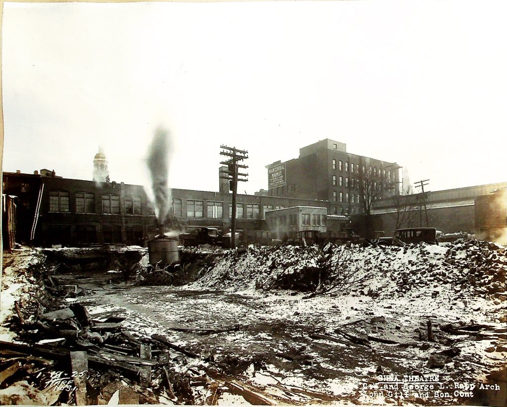 Steam shovels were used for the project to dig deep for the basement and sub-basement of Shea's Buffalo Theatre. This view from Pearl Street shows the back of the construction site, where heavy machinery was essential in shaping the foundation.