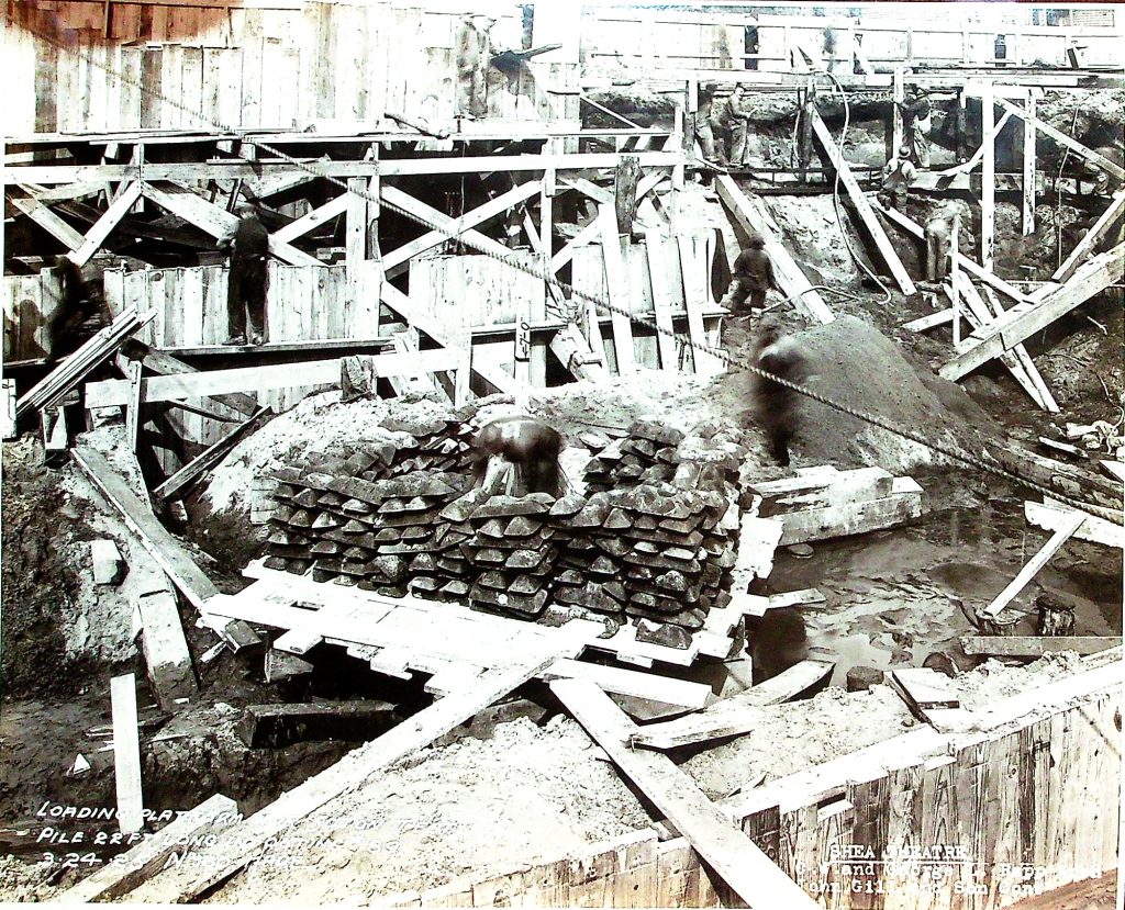 To support the massive structure of Shea's Buffalo Theatre, builders had to dig down to bedrock. A wooden platform was constructed, upon which 50 tons of iron ore ingots were piled to achieve the necessary weight, ensuring they reached solid ground. This meticulous process was repeated wherever a steel beam was to be installed, reflecting the careful engineering behind this monumental project.